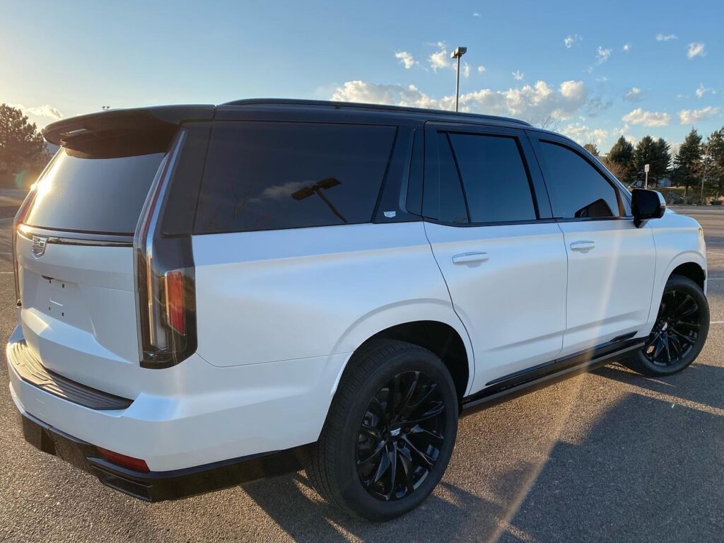white 2021 Cadillac Escalade Llumar window tinting back side view